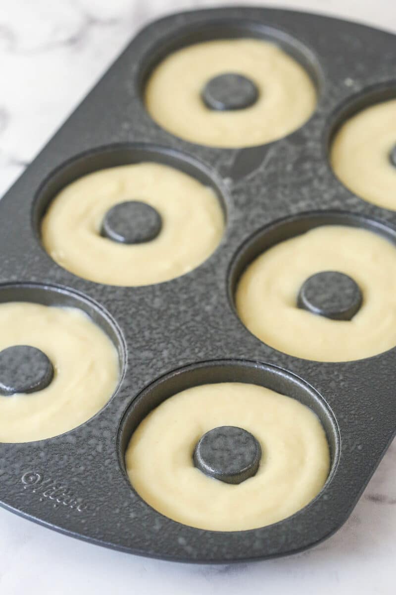 Donut batter in a donut pan.