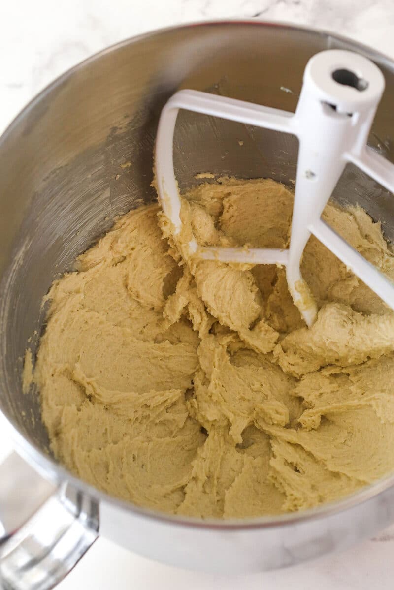 Creaming together butter and sugars until light and fluffy.