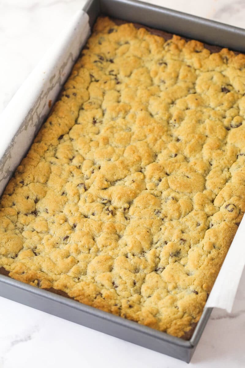 Brookies cooling in a baking pan.