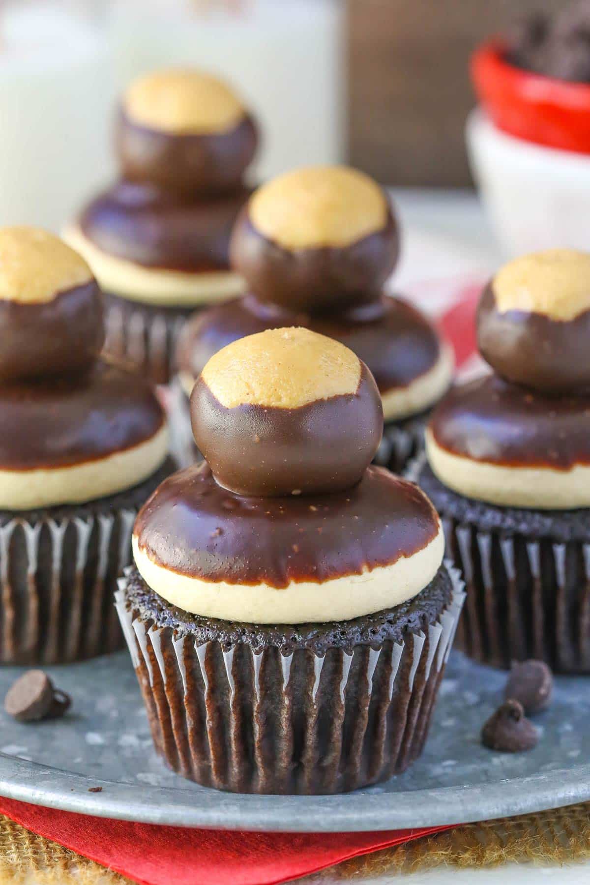 Several peanut butter chocolate buckeye cupcakes on a metal tray.