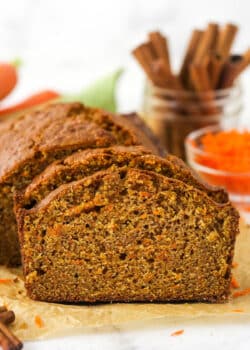 Slices of carrot cake taken from a loaf.