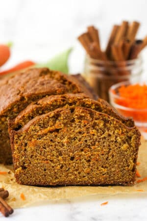 Slices of carrot cake taken from a loaf.