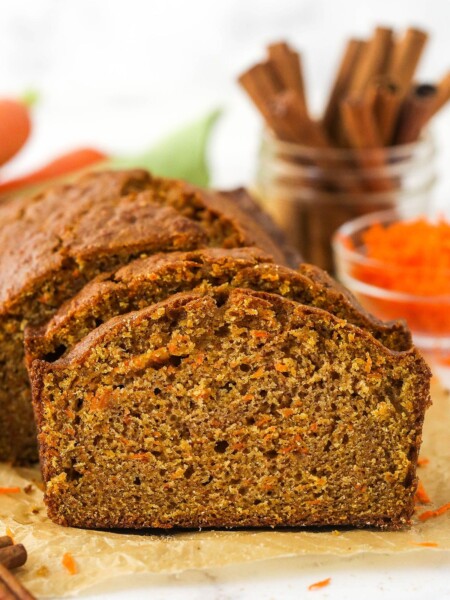 Slices of carrot cake taken from a loaf.