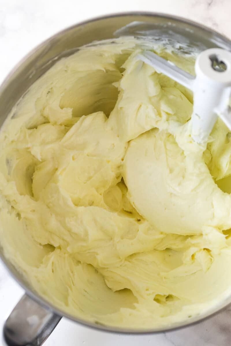 Beating together the cream cheese, sugar, and flour for cheesecake.