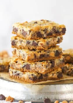 Side view of a stack of magic cookie bars.
