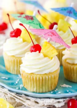 Pina colada cupcakes on a plate.