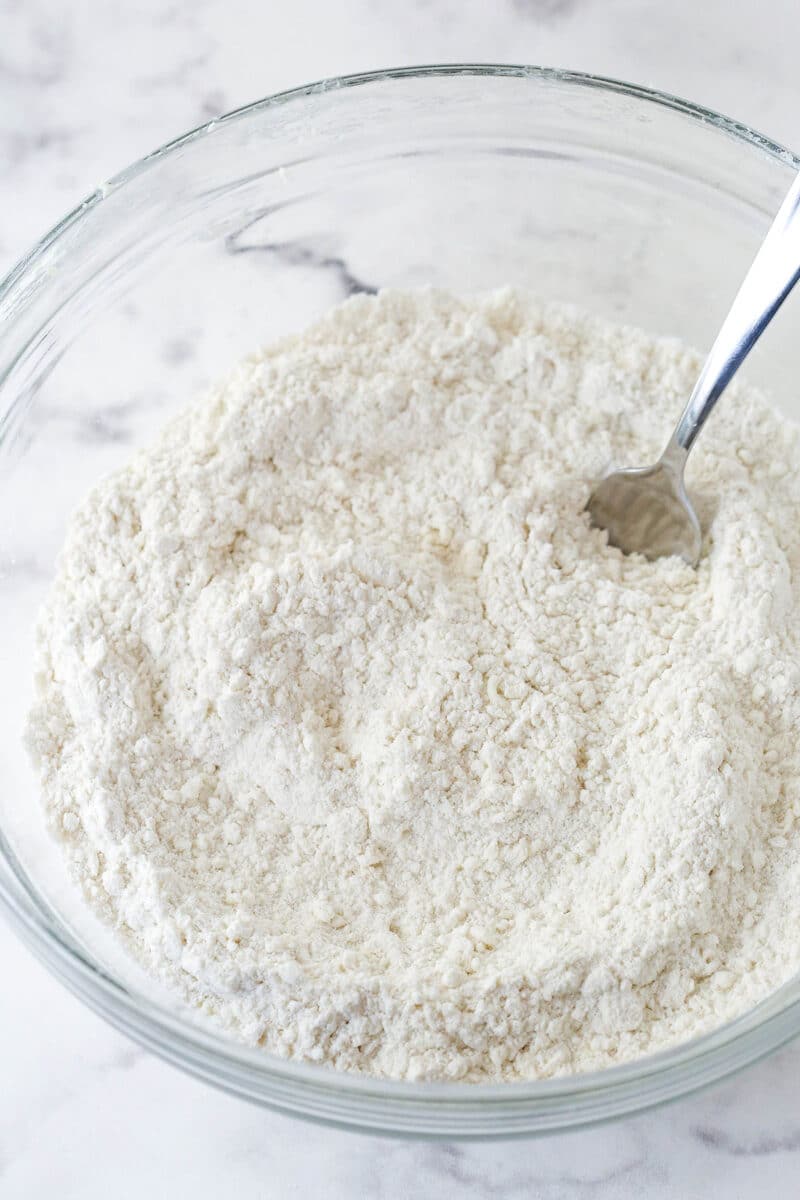 Mixing together the dry ingredients for a basic scone recipe.