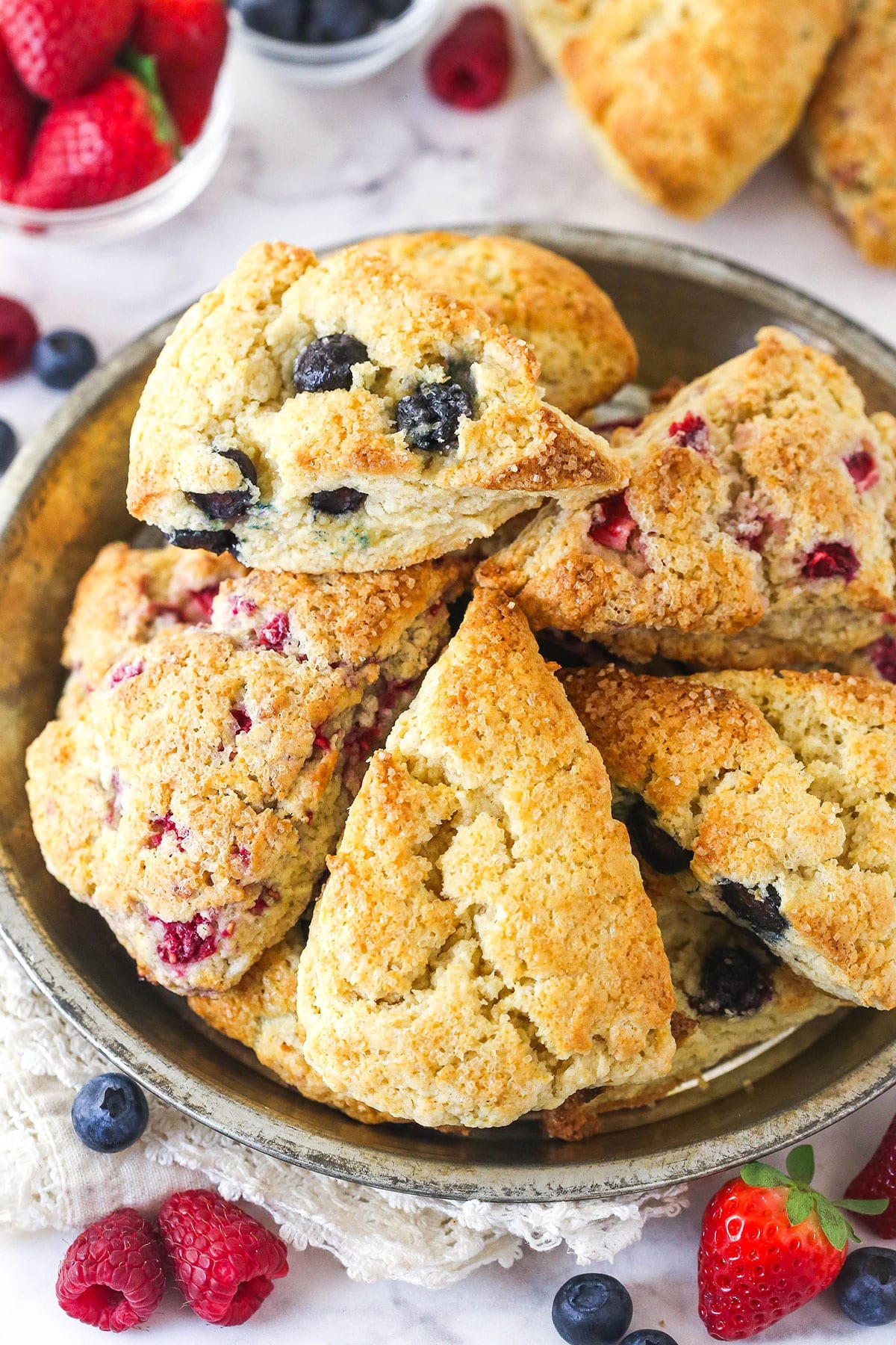 A plate loaded with different kinds of scones.