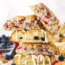 A stack of scones. The top one is broken in half.