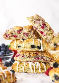 A stack of scones. The top one is broken in half.