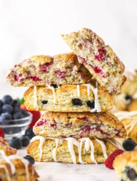 A stack of scones. The top one is broken in half.