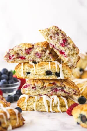 A stack of scones. The top one is broken in half.