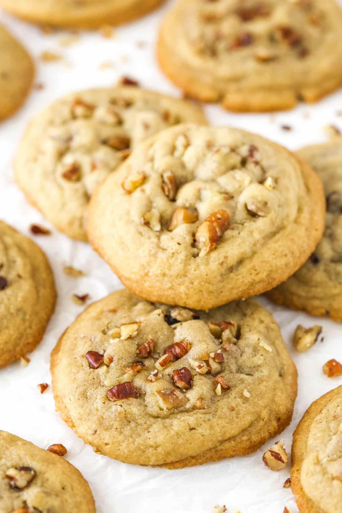 A few butter pecan cookies stacked on one another.