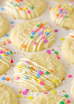 Decorated Coconut Sugar Cookies drying on parchment paper.