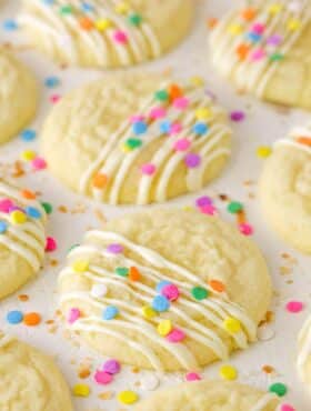Decorated Coconut Sugar Cookies drying on parchment paper.