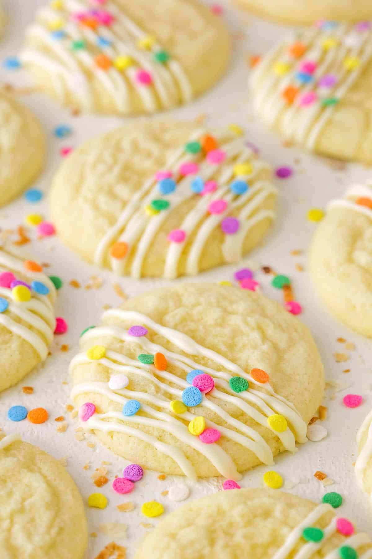 Decorated Coconut Sugar Cookies drying on parchment paper.