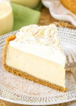 A slice of eggnog cheesecake on a small white plate.