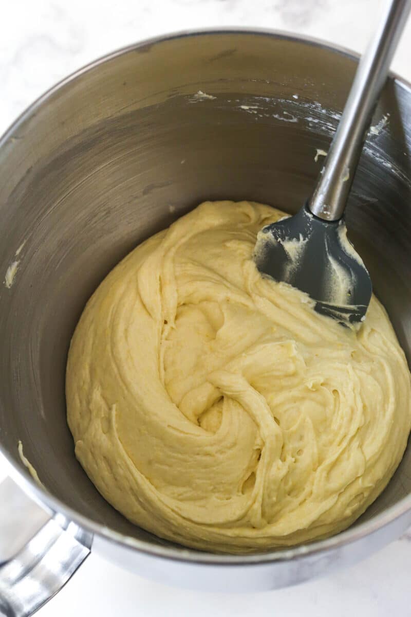 Folding egg whites into lemon blueberry bread batter.