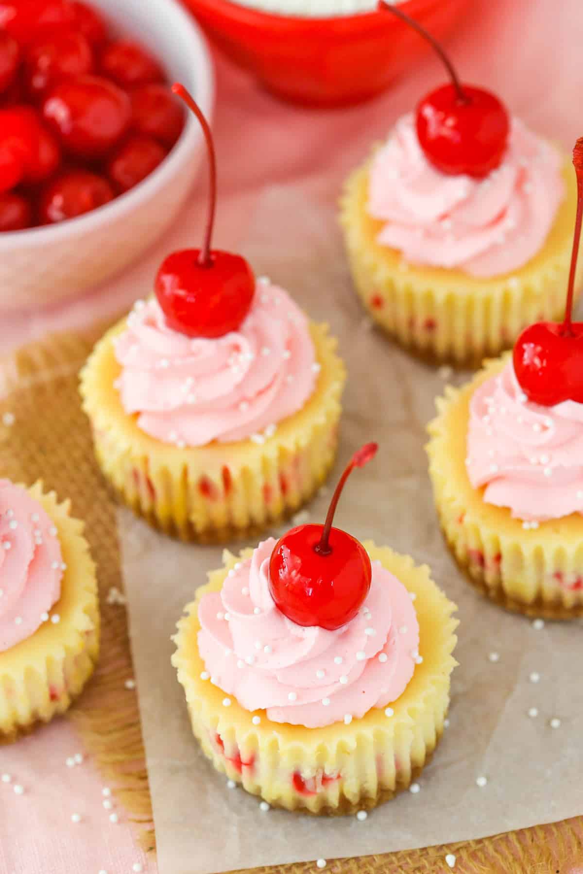 Top view of a few mini cherry almond cheesecakes.
