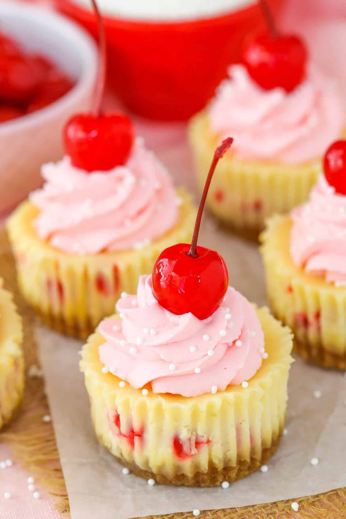 Close up of a mini cherry almond cheesecake.