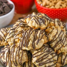 A pile of peanut butter chocolate chip macaroons on a silver plate.