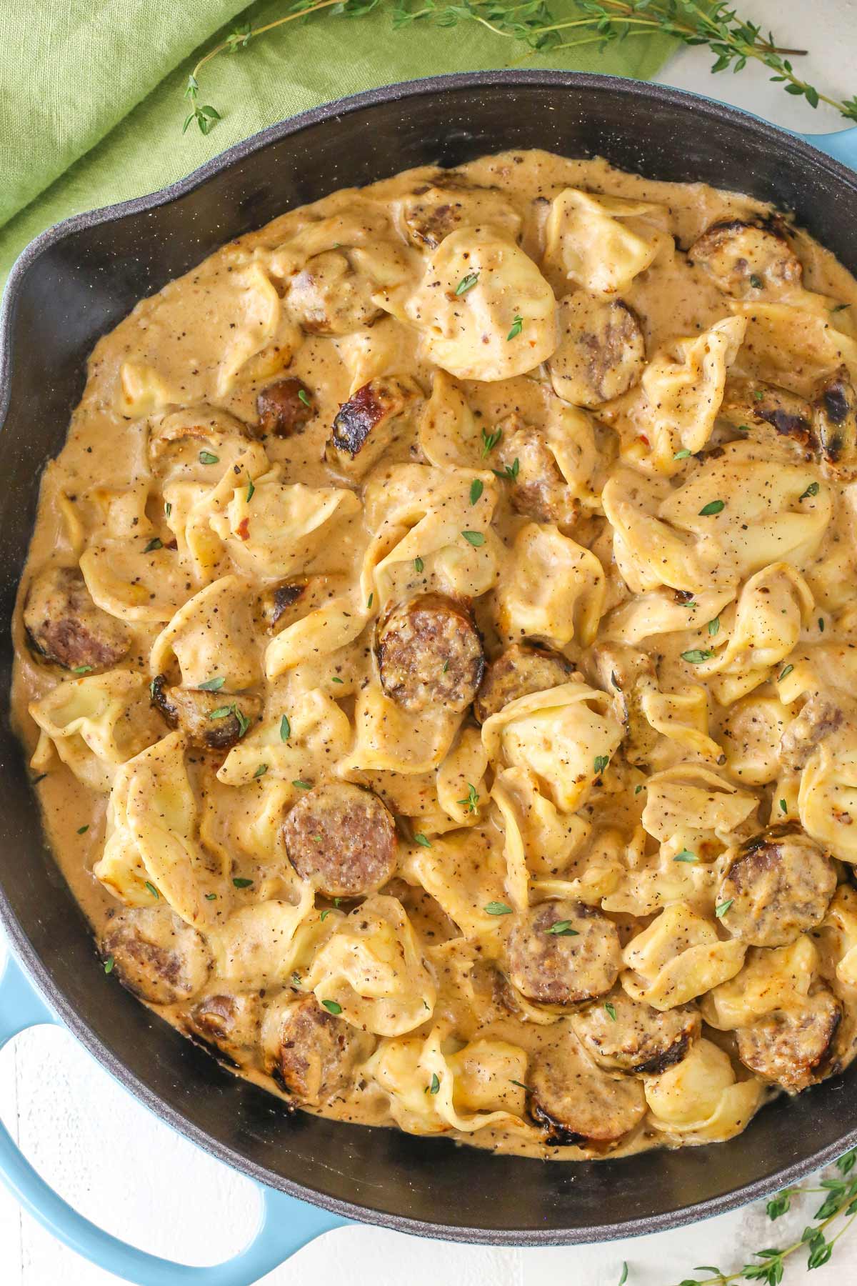 Top view of a pan of Sausage Tortellini Alfredo.