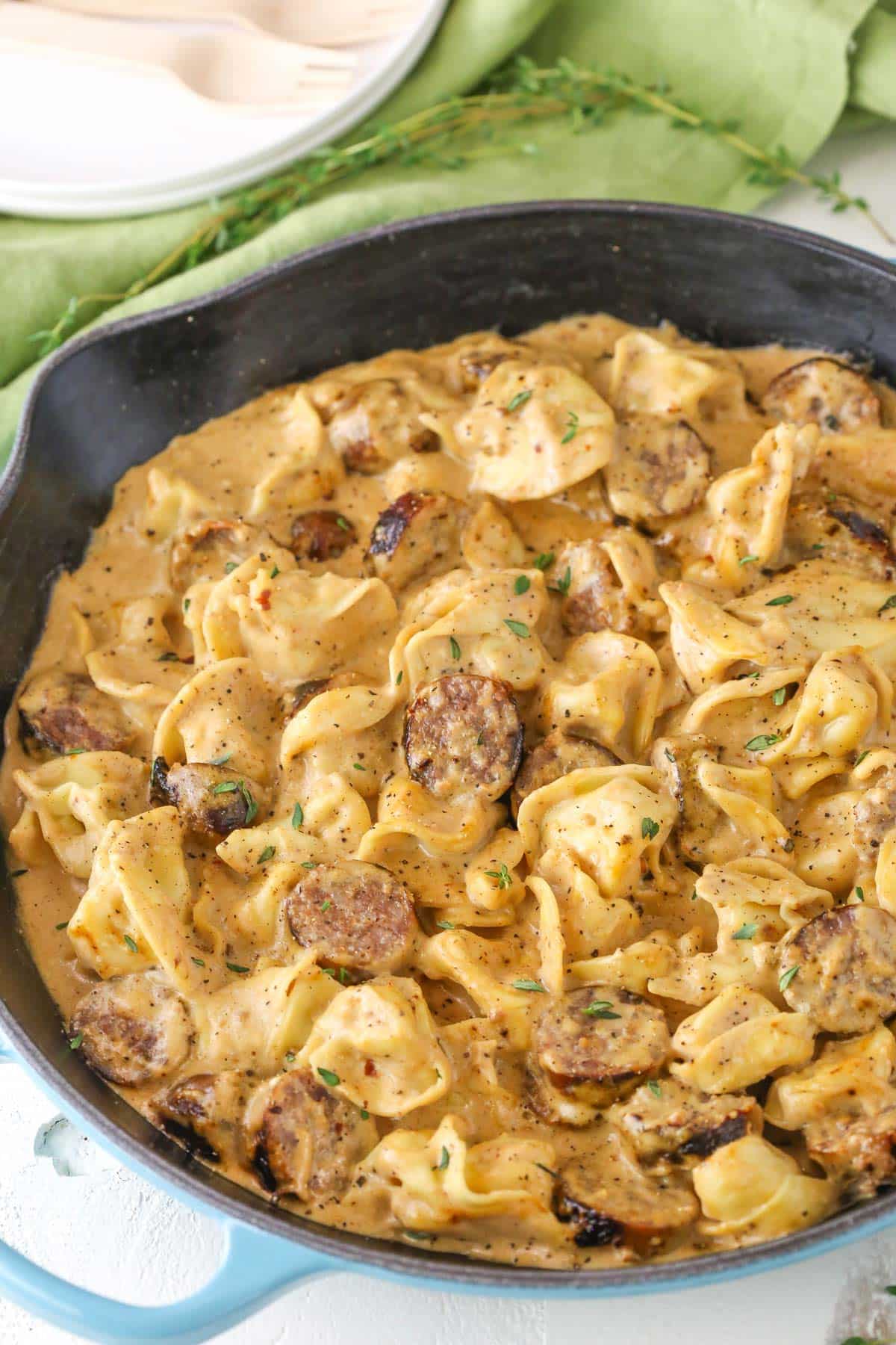Top view of a pan of Sausage Tortellini Alfredo.