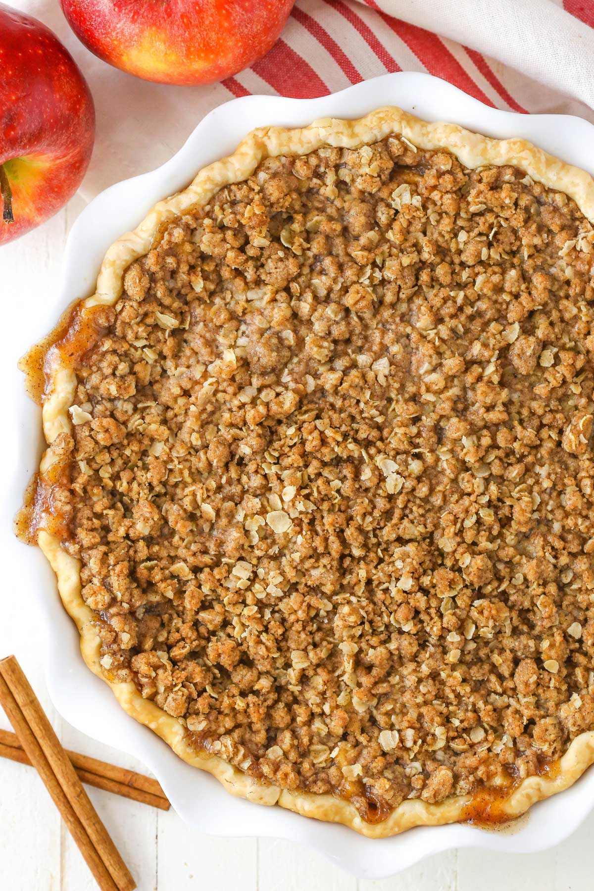 Overhead view of an apple crumb cheesecake pie.