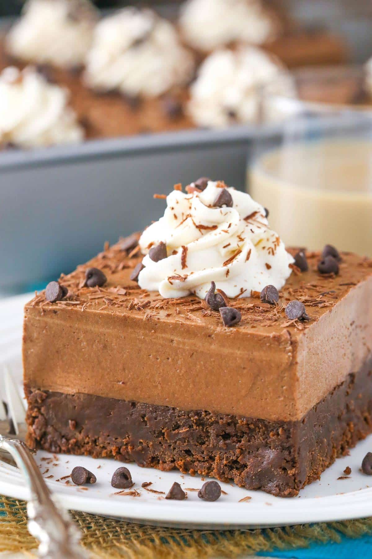 Close up of a slice of baileys chocolate mousse brownie cake.