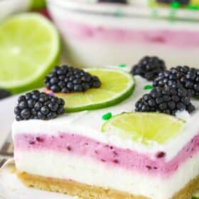 Close up of a slice of blackberry lime lush.