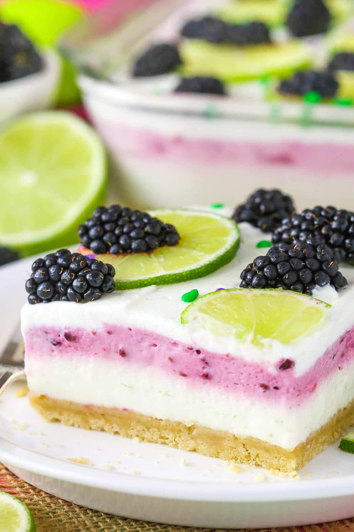Close up of a slice of blackberry lime lush.