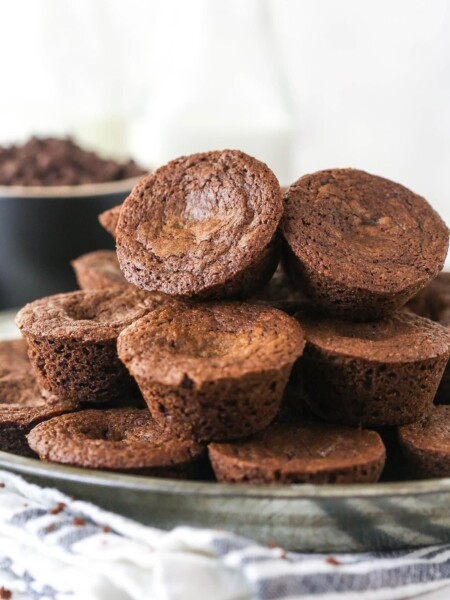 A plate loaded with brownie bites.