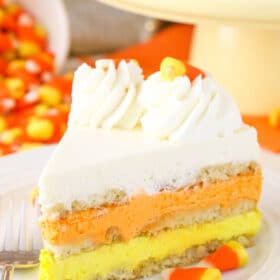 Close up of a slice of candy corn icebox cake.
