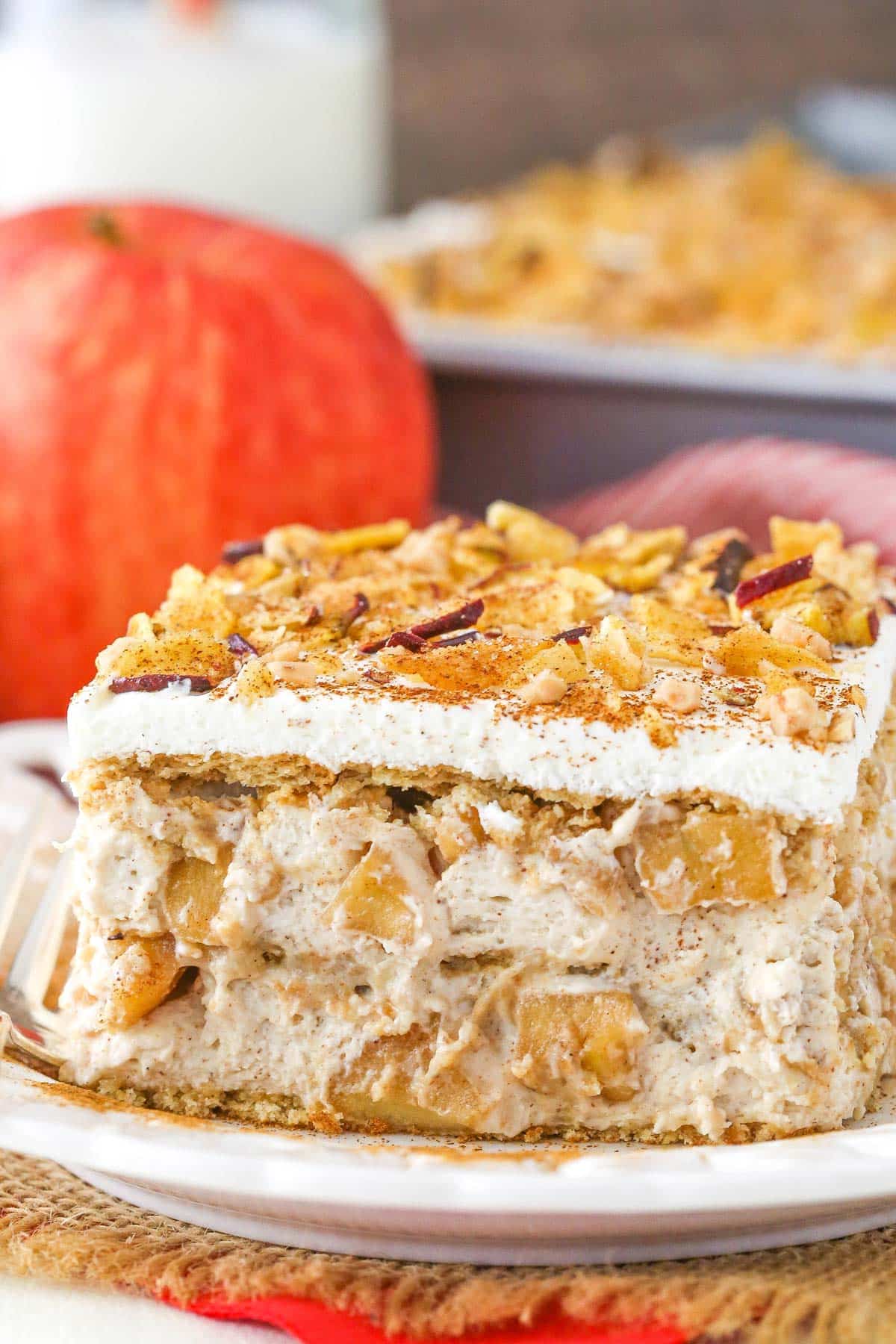A slice of cinnamon apple icebox cake on a white plate.