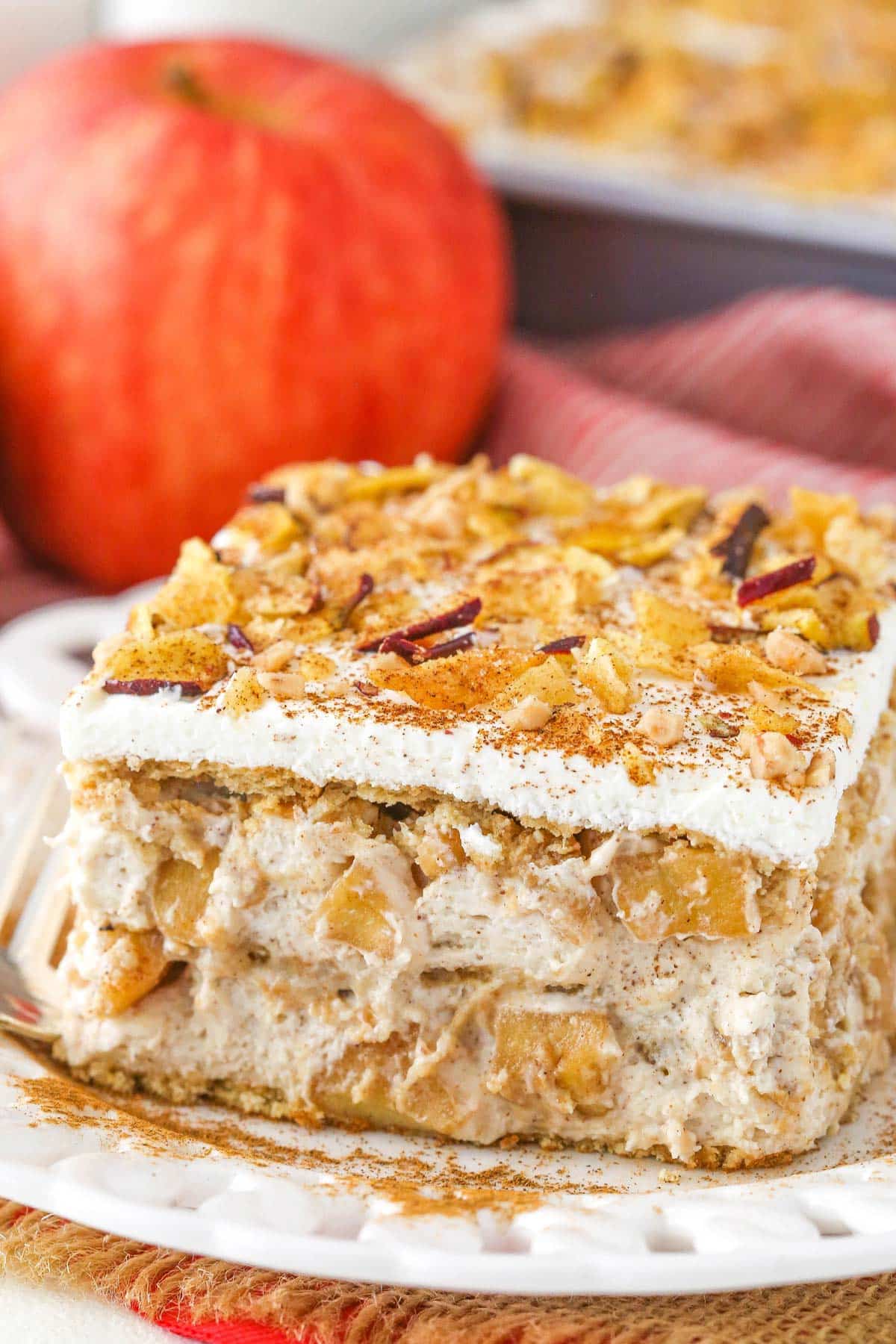A slice of cinnamon apple icebox cake on a white plate.