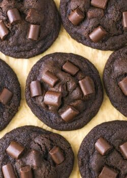 Top view of double chocolate chunk cookies on parchment paper.