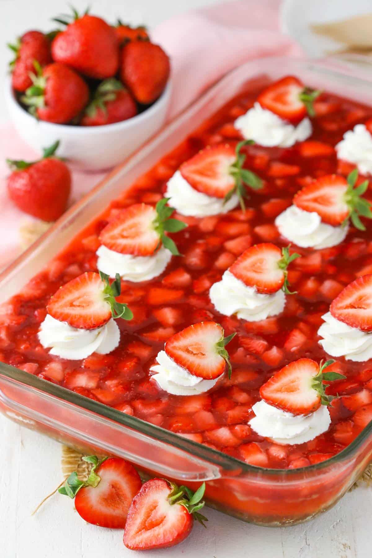 A casserole pan filled with easy strawberry cheesecake.
