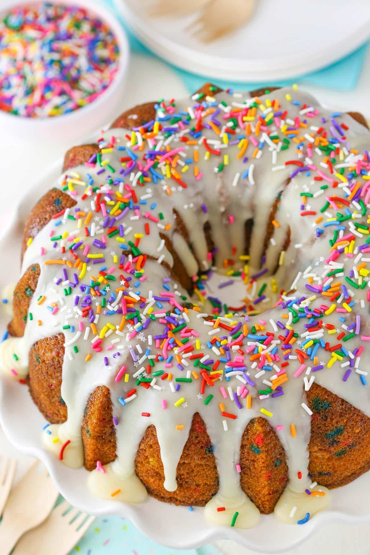Top view of an iced funfetti bundt cake.