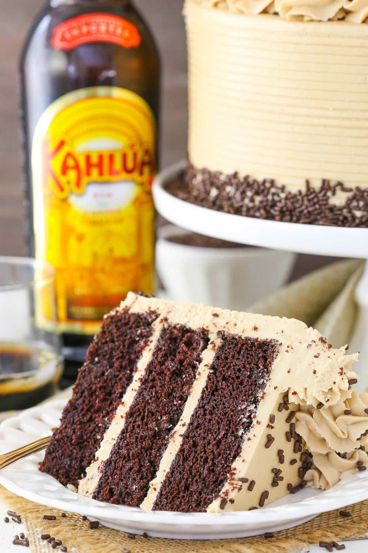 A slice of Kahlua coffee chocolate layer cake on a white plate.