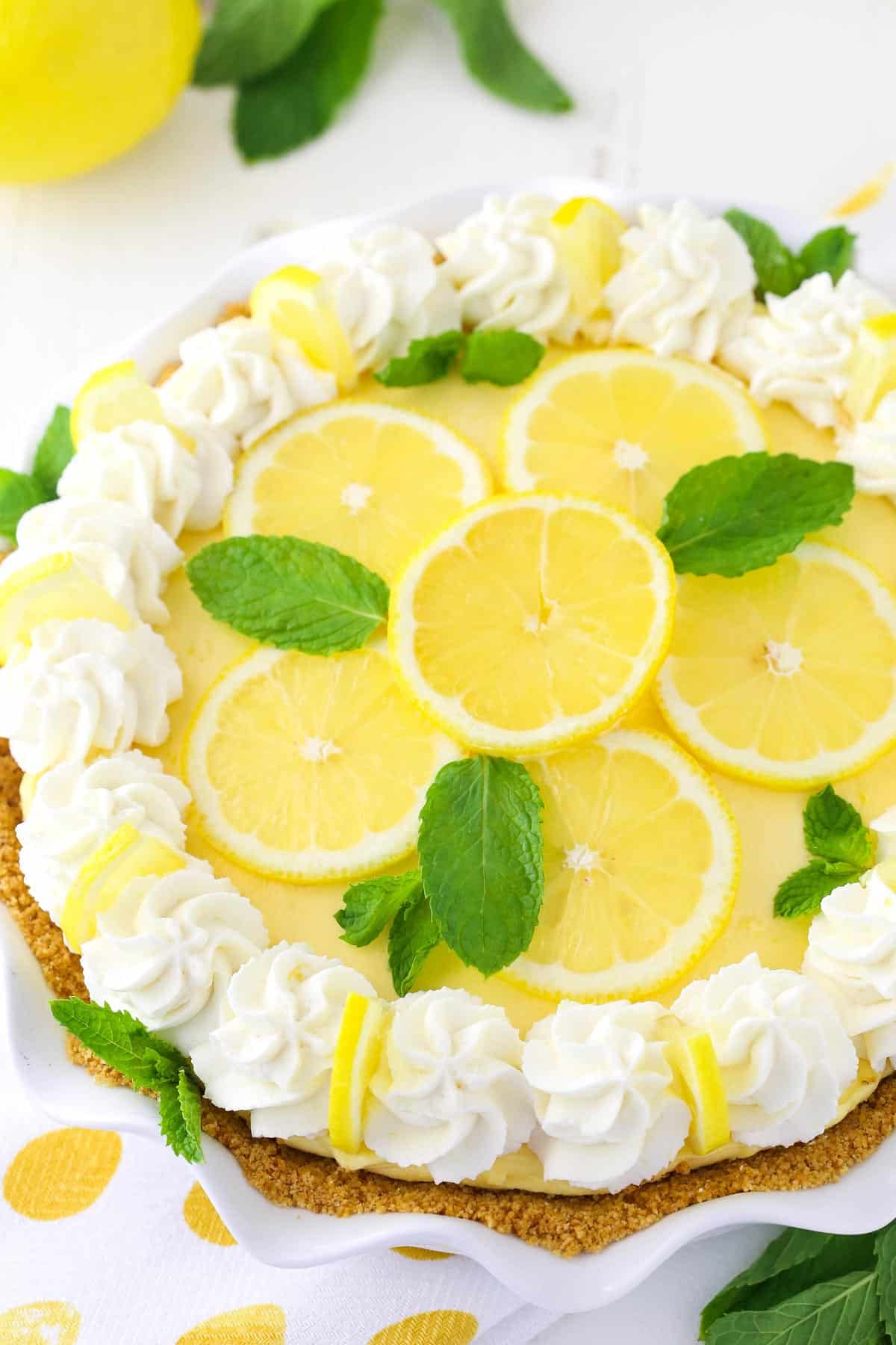 Top view of a lemon mascarpone cream pie in a ruffled pie plate.