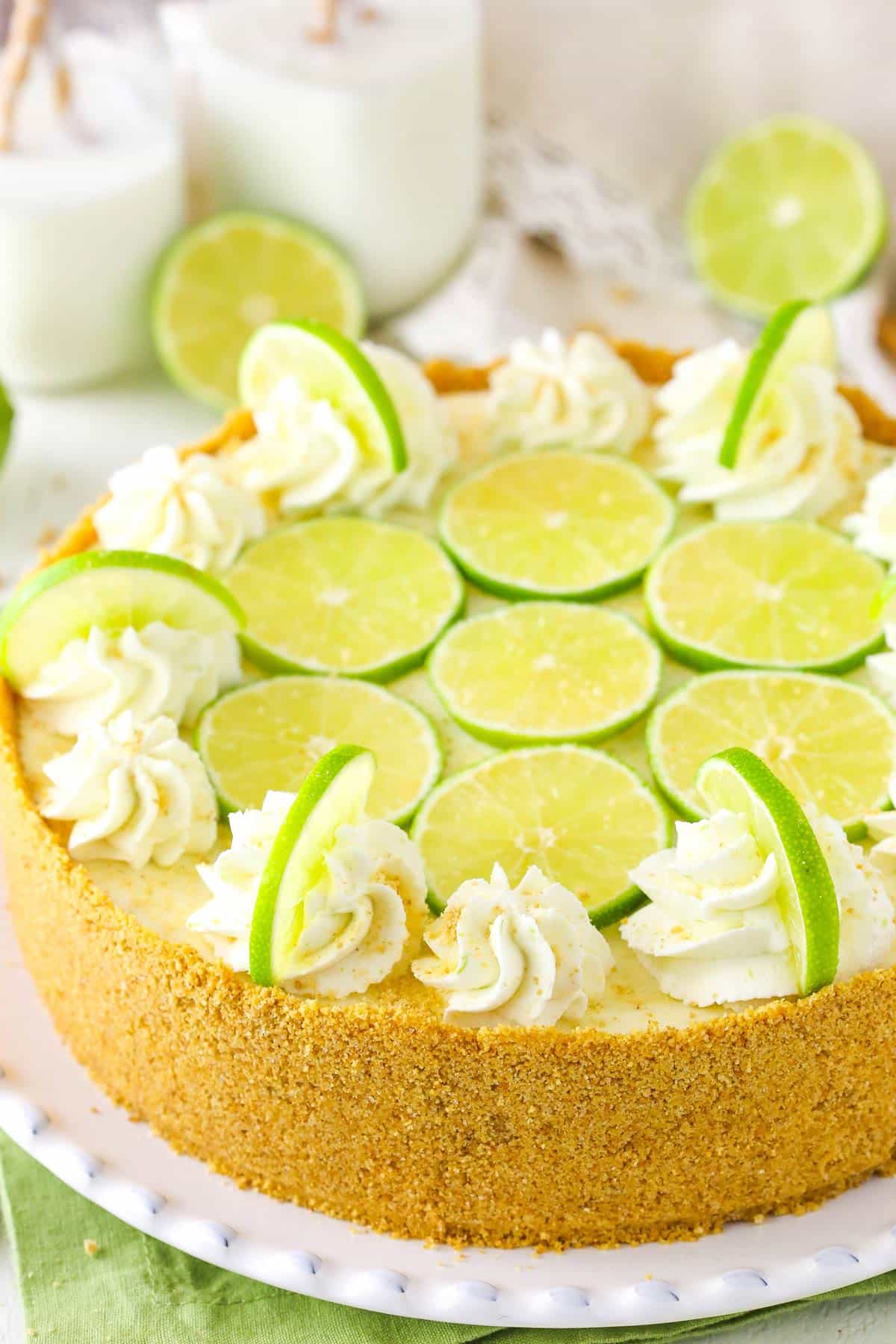 A no bake key lime cheesecake on a white platter.