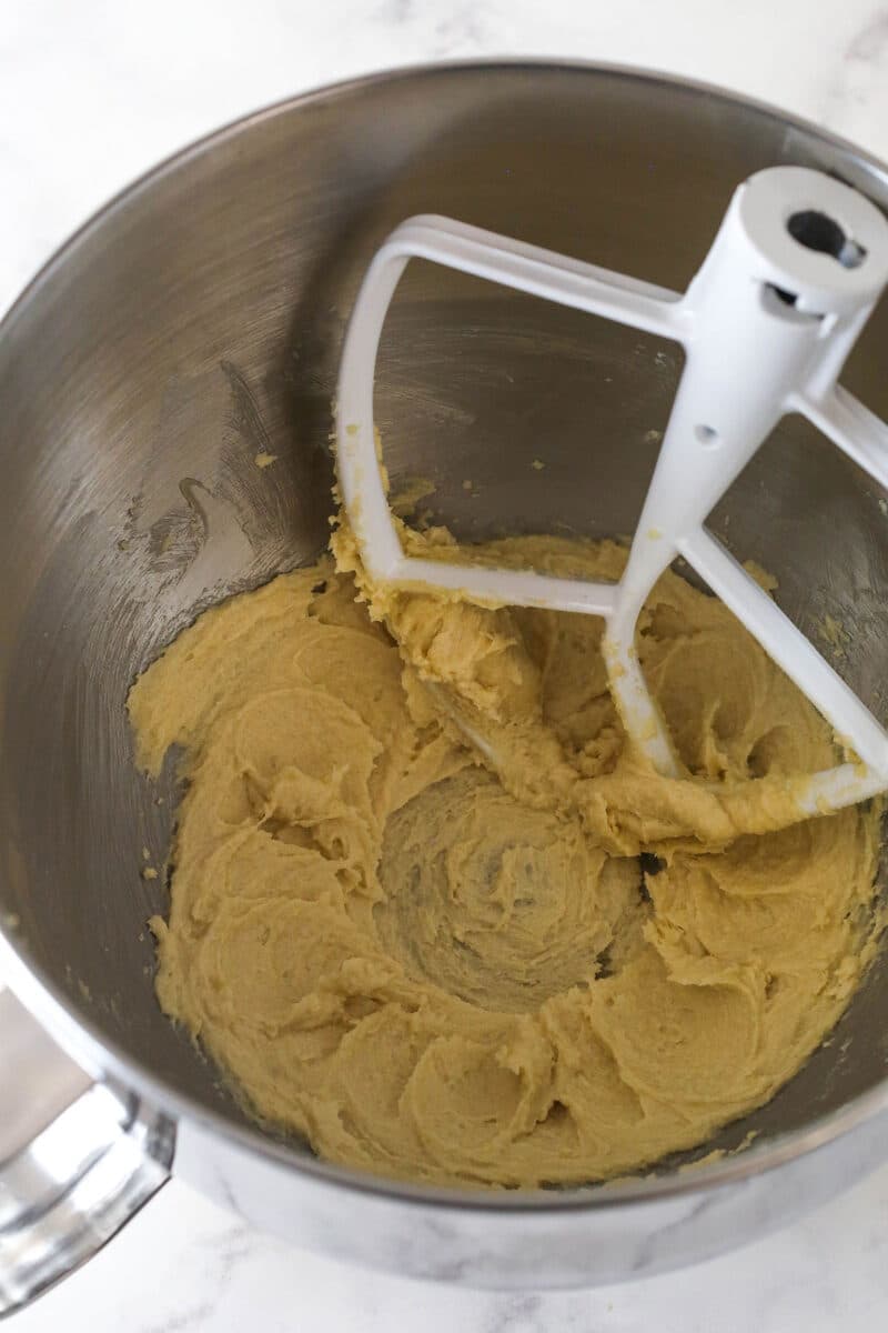 Creaming together butter and sugar for chocolate chip cookie dough.