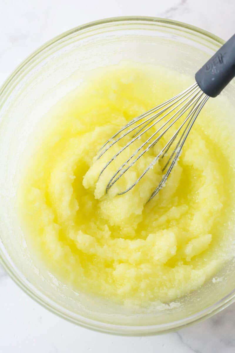 These nostalgia-filled, from-scratch Cosmic Brownies feature a fudgy brownie base topped with silky ganache and colorful sprinkles. Whipping together sugar and melted butter.