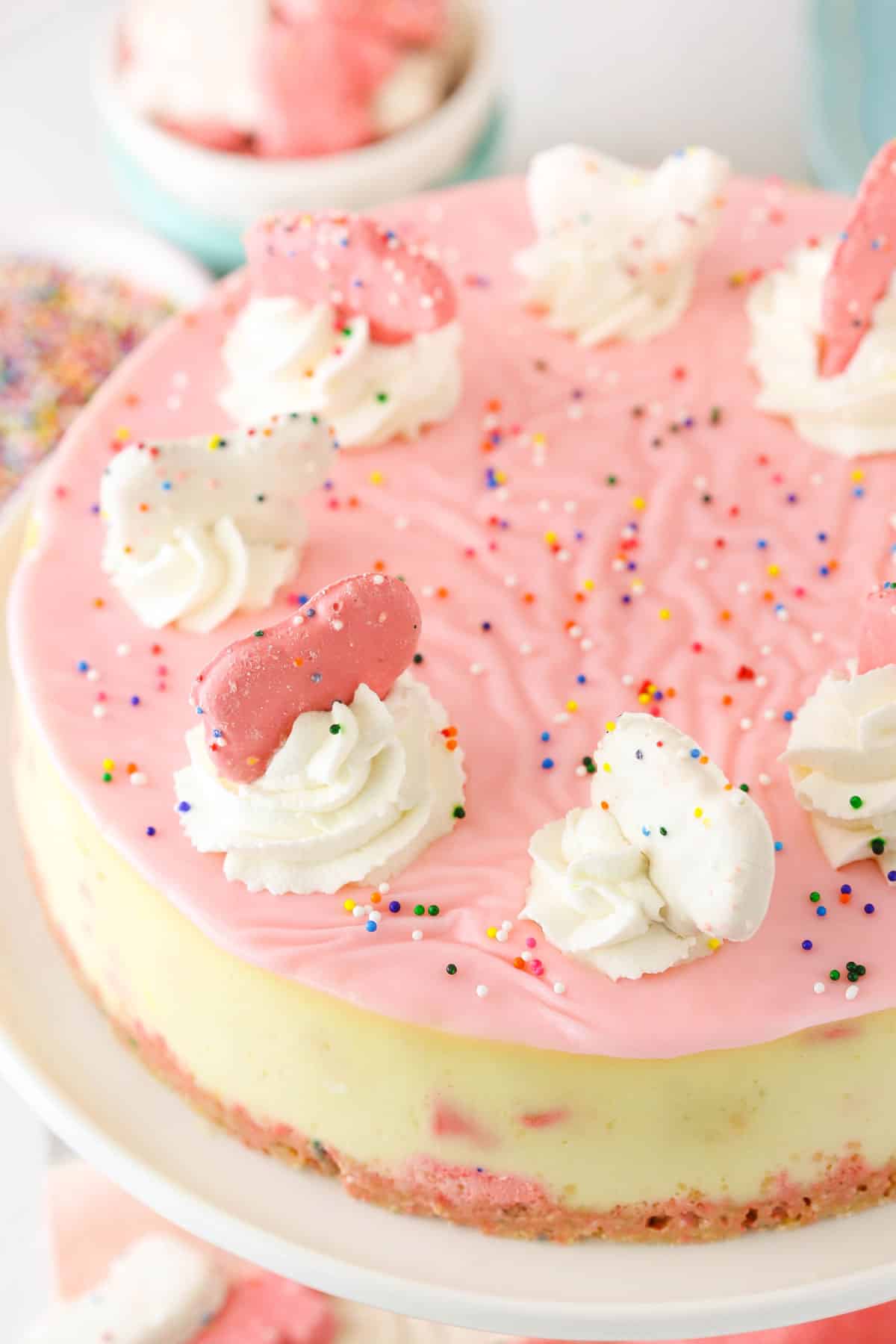 Top view of a frosted animal cookie cheesecake.