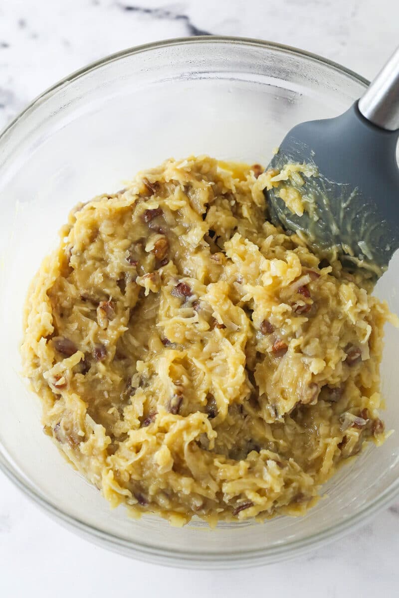 Allowing German chocolate cake filling to cool in a bowl.