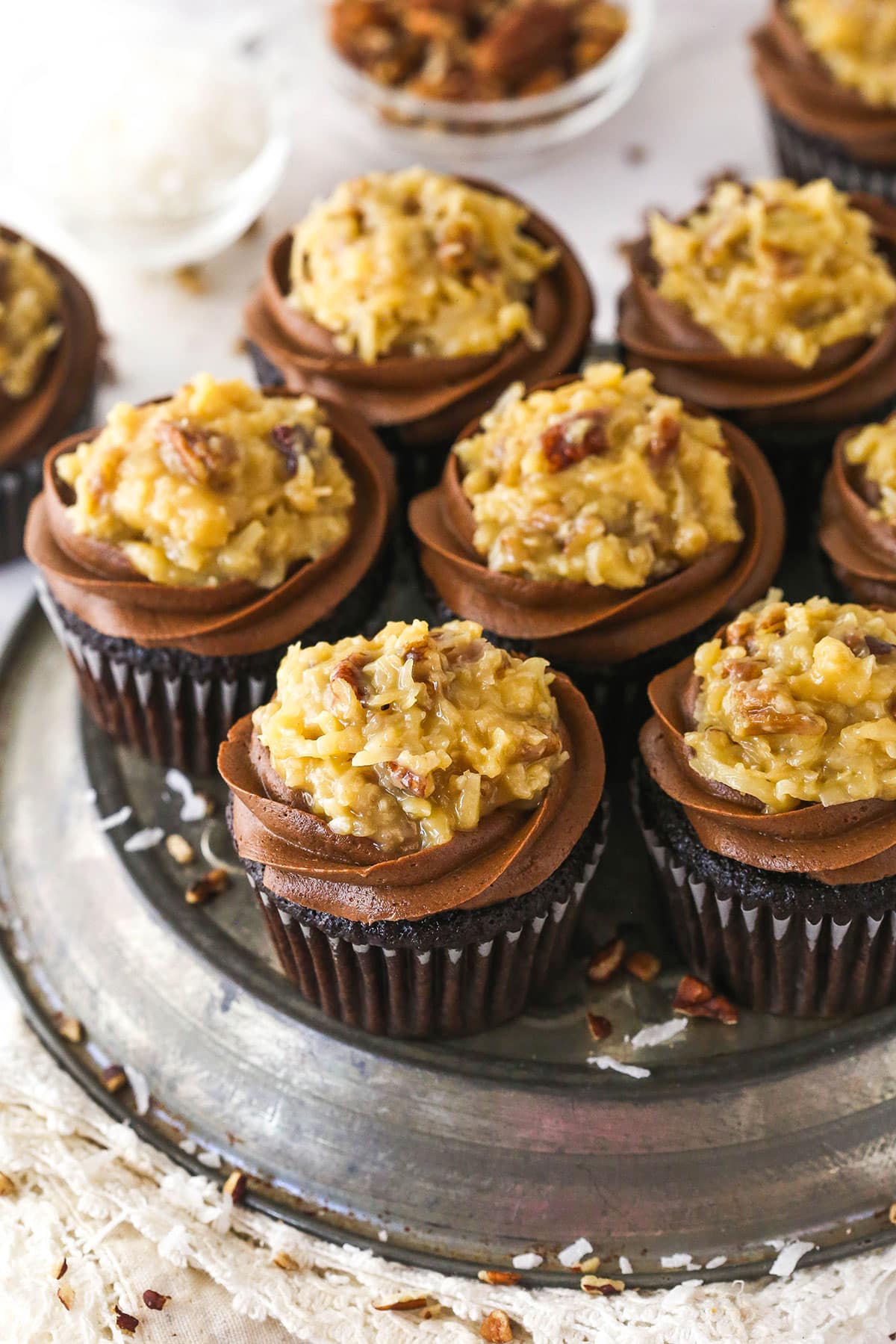 Overhead image of a platter of German chocolate cupcakes.