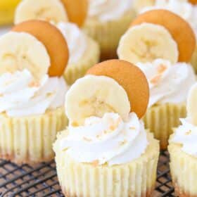 Close up of mini banana pudding cheesecakes on a wire rack.