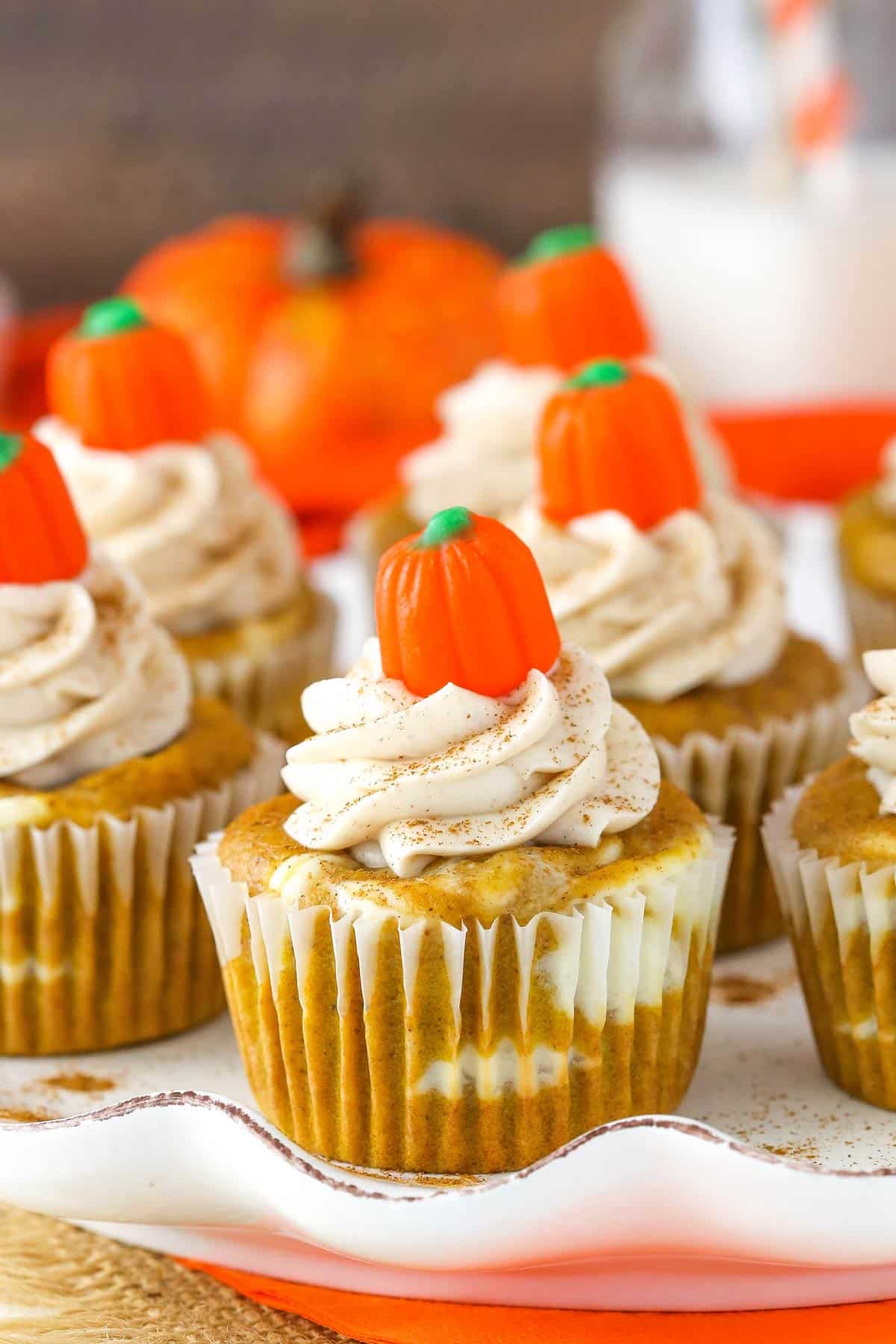 Close up of pumpkin cheesecake swirl cupcakes.