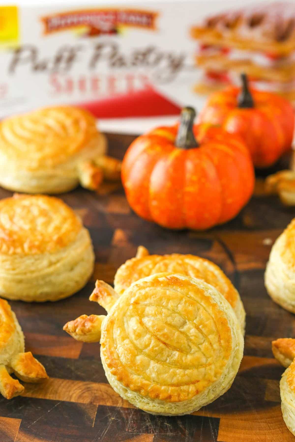 Close up of two stacked pumpkin spice pumpkin pastries.