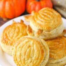 A plate piled with pumpkin spice pumpkin pastries.
